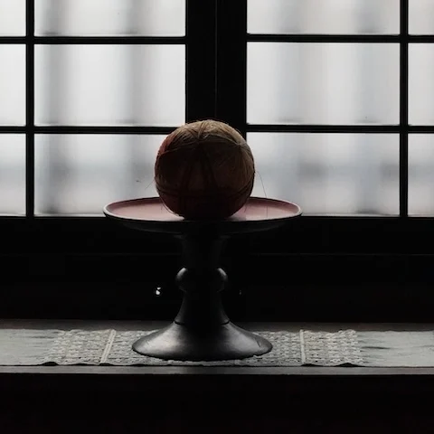 Traditional Japanese temari balls placed by the window at the Kawai Kanjiro Memorial House in Kyoto