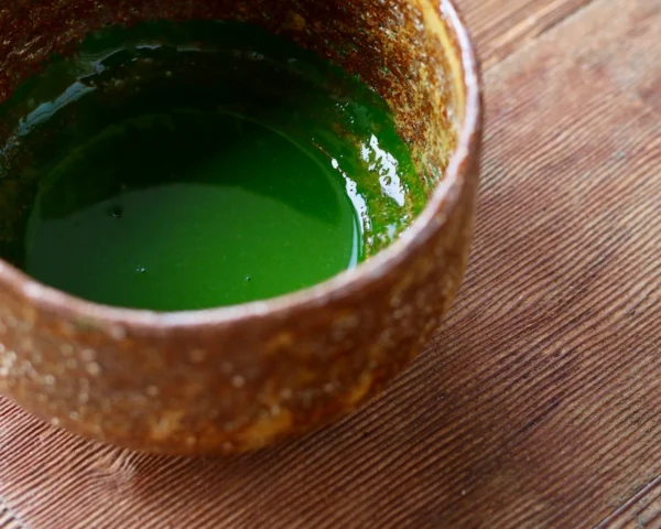 Koicha (thick matcha) prepared in a traditional Japanese tea bowl